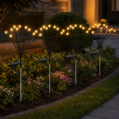 solar firefly garden lights creating warm glow across lawn pathway and backyard