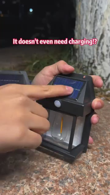 Black solar motion sensor wall lantern installation and nighttime motion activation demo