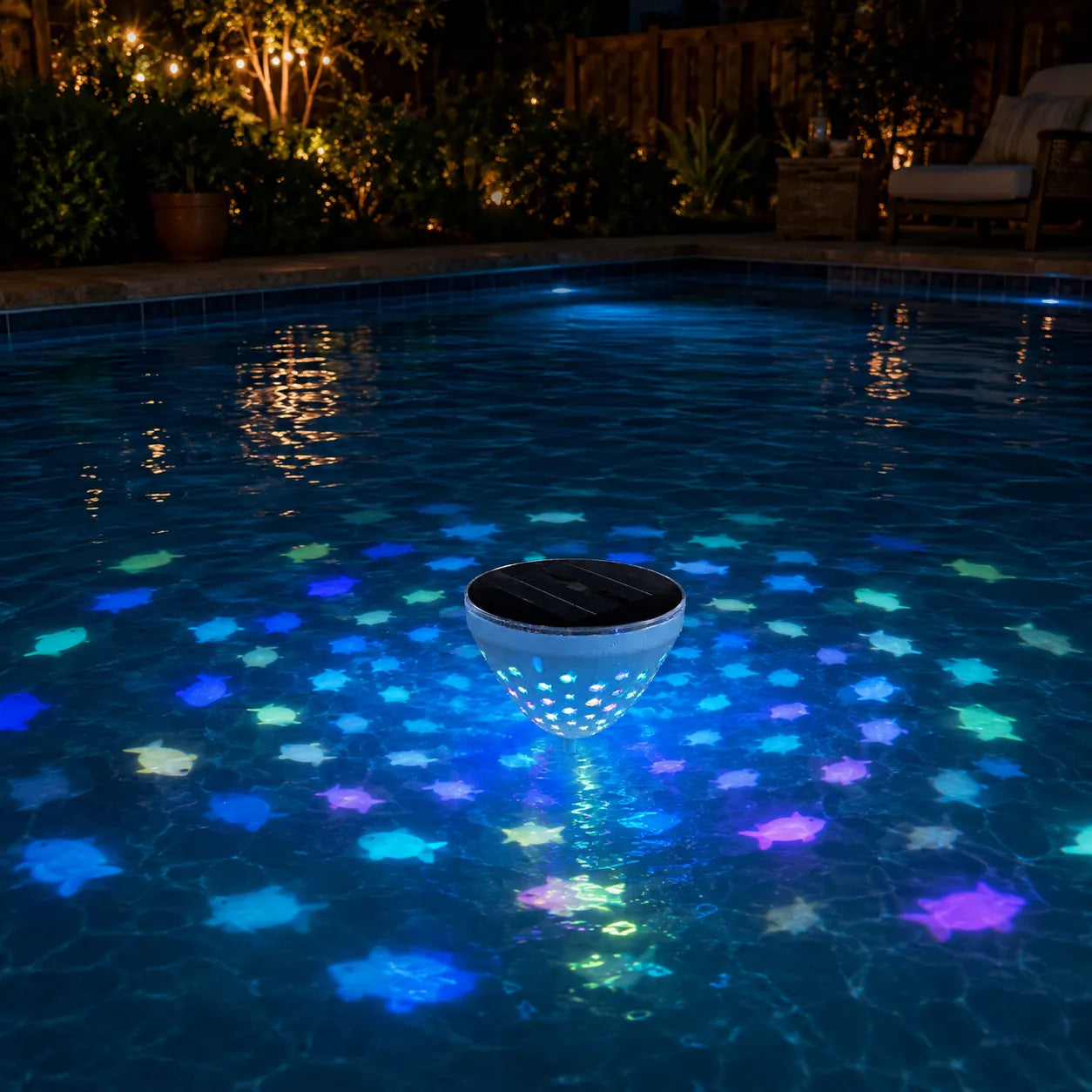 Single solar floating pool light glowing at night
