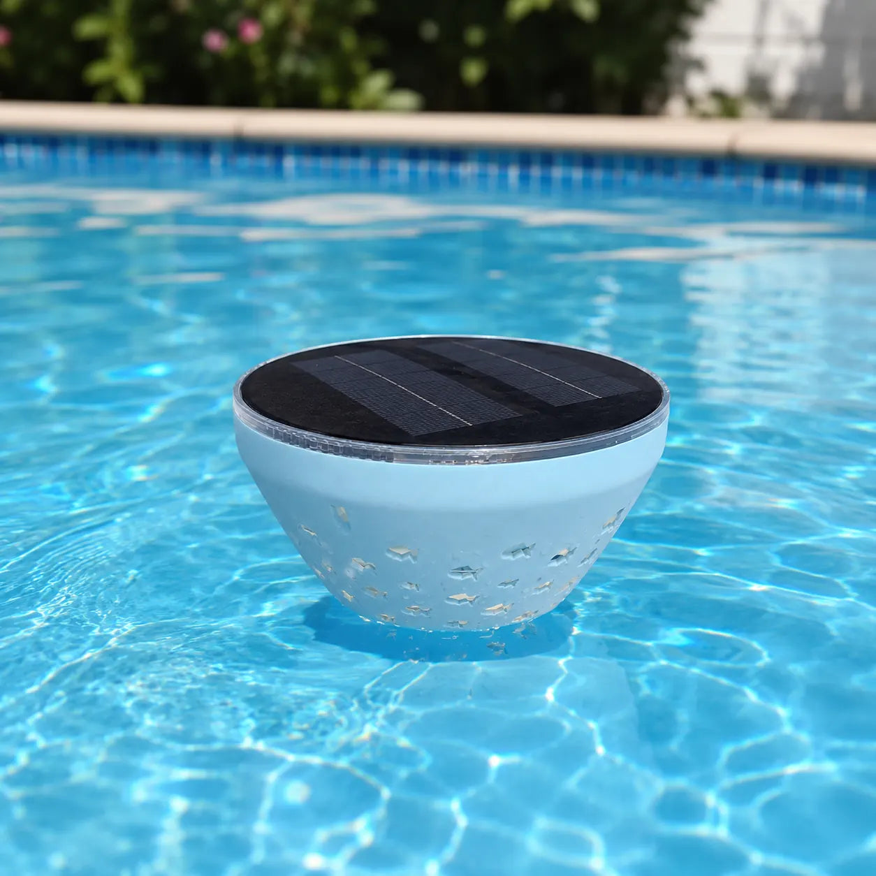 Solar floating pool light with top solar panel in daytime